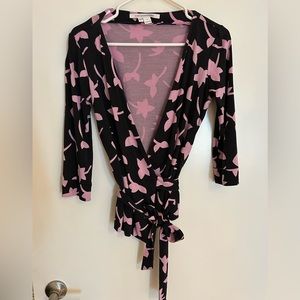 Diane Von Furstenberg wrap top. Size 6 gently warn